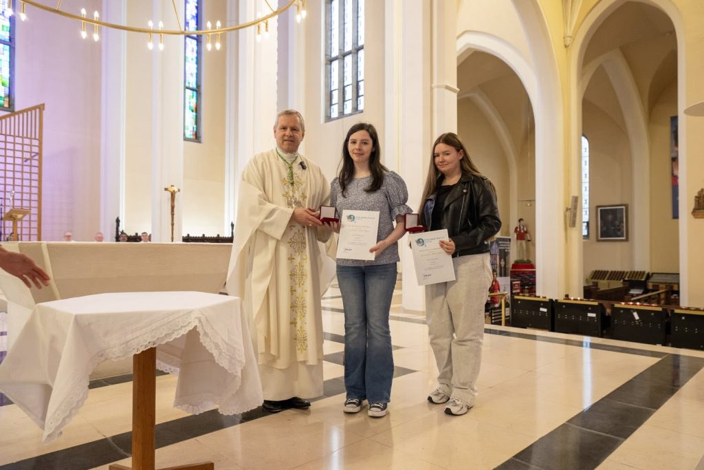 Bishop Fintan Gavin presents Gold Pope John Paul II Award medals to students during a special diocesan Mass in Cathedral of St. Mary and St. Anne, Cork.