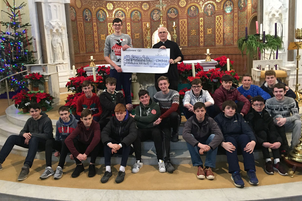 Students of Clonmel High School Present Fr Michael Toomey €1,345 from the funds raised